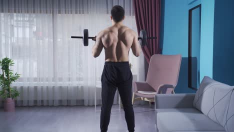 Young-man-doing-barbell-curls.-Athlete-young-man-trains-at-home.
